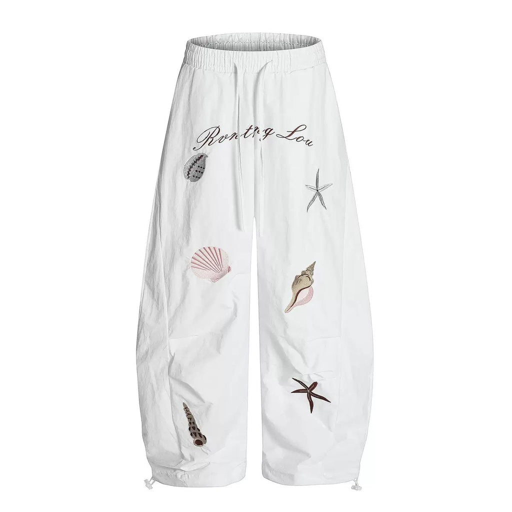 Embroidered shell print pants