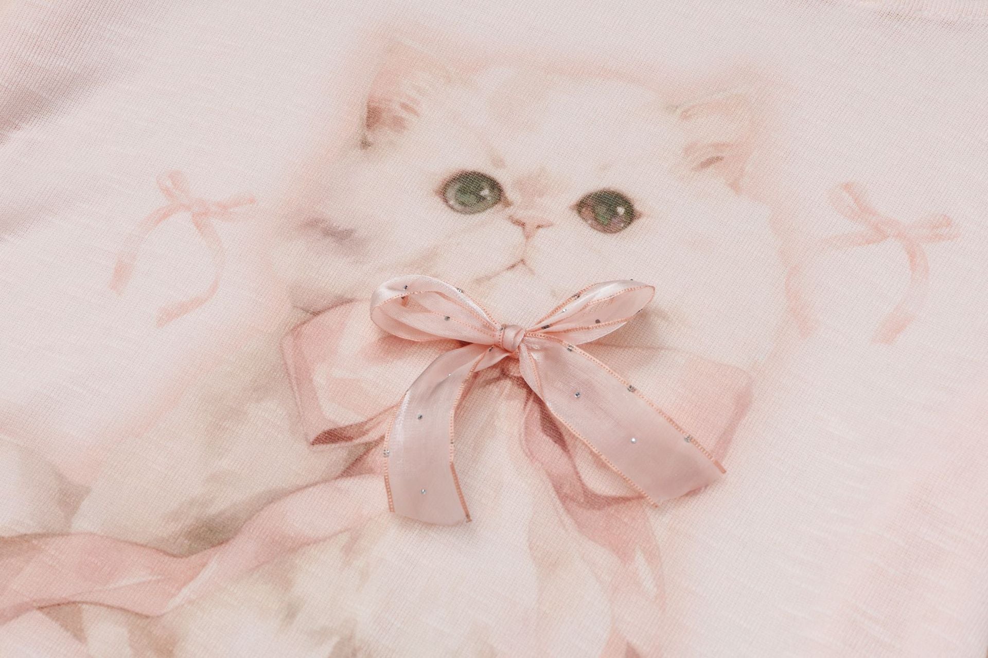 Pastel pink top with ribbon